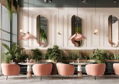 the interior of a restaurant with pink chairs and mirrors on the wall, along with potted plants