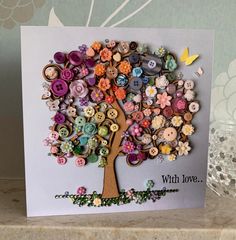 a card with buttons on it and a tree