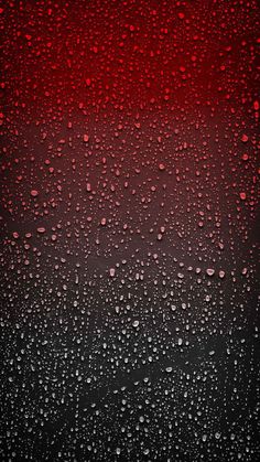 rain drops on the window with red and black background