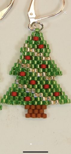 a bottle cap christmas tree ornament with scissors