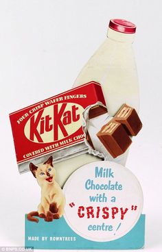 a bottle of milk and some chocolate with a cat on the label next to it