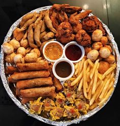 a platter filled with fried food and condiments