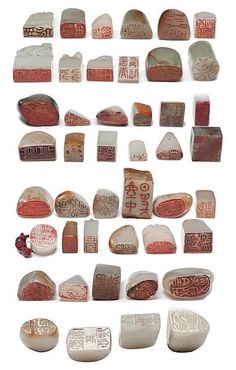 several different types of rocks and stones with writing on them, all in various shapes and sizes