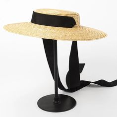 Complete your summer look with our Wide Brim Straw Boater Hat, a timeless accessory for sunny days. Crafted from straw, this boater hat features a wide brim that offers stylish sun protection. Perfect for beach outings or picnics, its classic design adds a touch of vintage charm to any outfit. Elegant Boater Hat With Visor For Spring, Elegant Spring Boater Hat With Visor, Elegant Boater Hat With Visor For Vacation, Elegant Visor Boater Hat For Vacation, Chic Spring Boater Hat Made Of Paper Straw, Elegant Summer Panama Visor Hat, Classic Summer Sun Hat With Visor, Short Brim Boater Hat In Paper Straw For Spring, Spring Short Brim Boater Hat In Paper Straw