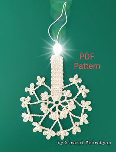 a crocheted ornament hanging on a green background with the text free pattern