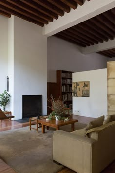 a living room filled with furniture and a fire place