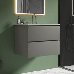 a bathroom with a sink, mirror and shower stall in it's side view