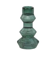 a green glass vase sitting on top of a table