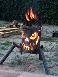 an outdoor fire pit with glowing eyes on it