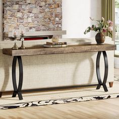 a living room with a stone wall and wooden flooring