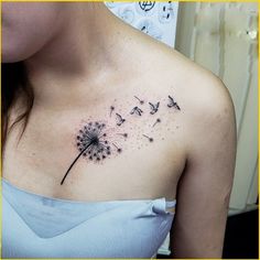 a woman with a dandelion tattoo on her chest