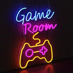 a neon sign that says game room 2 and 3 with a video game controller on it