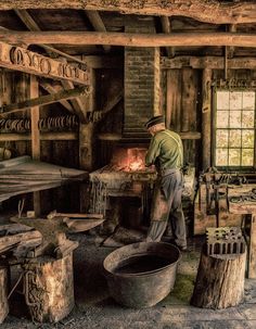 a man is working in an old fashioned wood - burning stove and making something out of it