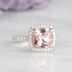 Beautiful Classic Cushion Morganite Ring ►Made of solid sterling silver with rhodium finish (925) ►Accented with simulated diamonds (CZ) ►Average band width: 1.9 mm Center Stone: Morganite Color: Peachy-Pink Shape: Cushion Measurements: 8.0 x 780 mm Carat Weight: 2.4 ct. (approx.) Gemstone creation: Lab-Created ✓ 100% Nickel-Free ✓ Hypoallergenic ✓ Comfort Fit ✓ Free Ring Box ✓ Free USA Shipping ✓ Ready to ship next business day Classic Pink Jewelry For Promise, Pink Cushion Cut Ring For Anniversary, Classic Pink Promise Ring, Vintage Pink Wedding Rings, Elegant Morganite Wedding Rings, Blush Ring With Center Stone For Promise, Elegant Blush Ring For Anniversary, Elegant Blush Rings For Anniversary, Elegant Blush Rings For Promise