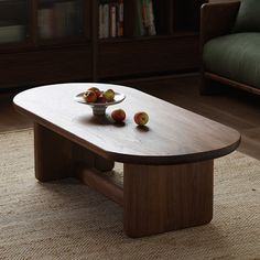 a bowl of fruit on a coffee table