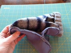 someone is making a stuffed animal out of felt