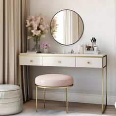 a dressing table with a mirror, stool and flowers