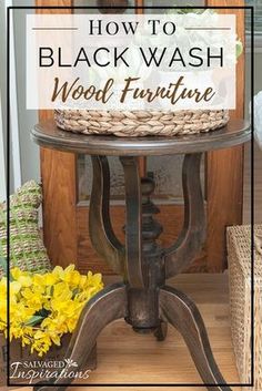 a black wash wood furniture with yellow flowers in the background and text overlay that reads how to black wash wood furniture