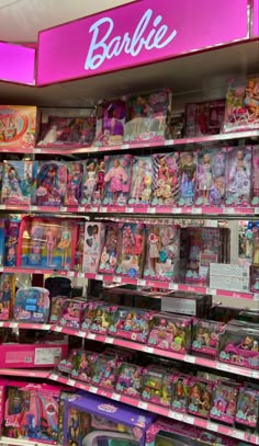 barbie toys are on display in a toy store