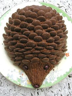 a cake shaped like a hedgehog on a plate