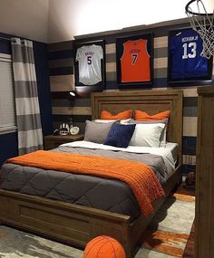 a basketball themed bedroom with orange and gray decor