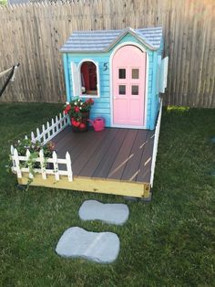 a small doll house in the backyard