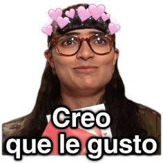 a woman wearing glasses with hearts on her head and the words creo que le gusto