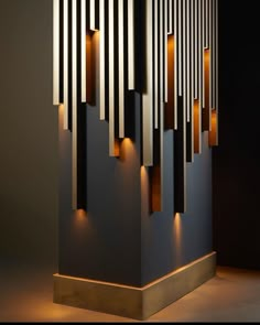 an artistic sculpture with several lights on it's sides in the shape of rectangles