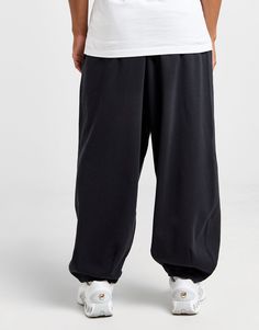 Freshen up your off-duty essentials with these men's Oversized Joggers from Nike. In a Black colourway, these joggers are made with soft French terry cotton for supreme comfort. They have an exaggerated, oversized fit, and feature an elastic waistband with a drawcord to adjust the fit. They have wide legs with tapered cuffs, and side pockets to stash your essentials. Finished with signature Nike branding at the thigh. Machine washable. | Our model is 6'0" and wears a size medium. Oversized Joggers, Nike React Vision, 270 Nike, Nike Branding, Jd Sports, Wide Legs, Outdoor Style, Adidas Nike, Chucks Converse