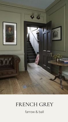 the interior of a house with french grey paint and wood flooring on the walls