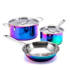 three pans with lids and spoons are shown on a white background, one has a blue holographic coating