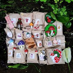 a table topped with lots of bags filled with different types of items on top of each other