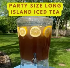 there is a drink in the glass with lemon slices on it and a sign that says party size long island iced tea