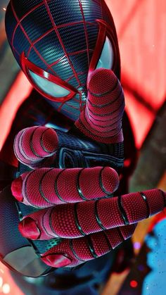 a close up of a spider man mask and gloves