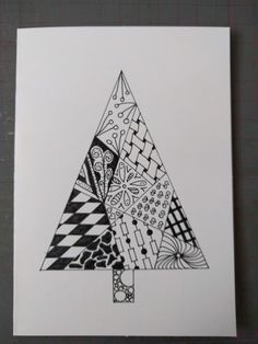 a black and white drawing of a christmas tree with geometric designs on it's sides