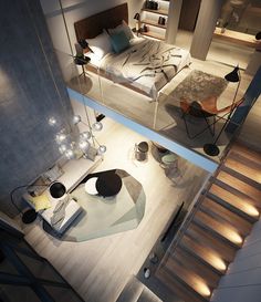 an aerial view of a modern bedroom with stairs leading up to the bed and sitting area