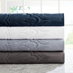 four towels stacked on top of each other