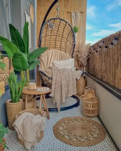 an outdoor area with wicker furniture and potted plants