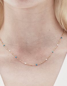 DESCRIPTION Elevate your jewellery game with the Rosa Necklace in Gold and Turquoise by Jolie & Deen. This delicate chain necklace features a stunning combination of natural turquoise stones and freshwater pearls, creating a minimalist yet eye-catching piece. Perfect for both casual and formal wear, this necklace adds a pop of subtle colour and sophistication to any outfit. Whether worn on its own for a soft statement or layered with other necklaces for a chic, trendy look, this piece is a versa Natural Turquoise Stone, Delicate Chain, Turquoise Stones, Natural Turquoise, Layering Pieces, Turquoise Stone, Formal Wear, Freshwater Pearls, Layering