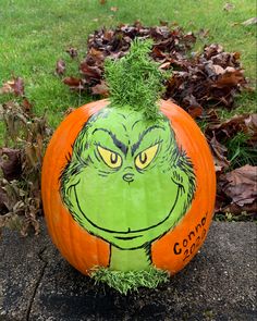 a pumpkin with the grin face painted on it