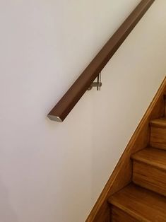 a close up of a stair rail on a wall