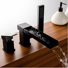 a black faucet with water running from it