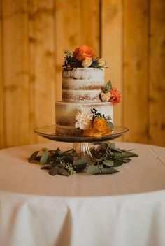 the vineyards, wedding cake Rustic Wedding Cake Orange Flowers, Two Tier Wedding Cake Rustic Fall, 2 Tier Cake With Fresh Flowers, Two Teir Wedding Cake Fall, Rust Color Wedding Cake, Simple Autumn Wedding Cake, Fall Small Wedding Cakes, Fall Flower Wedding Cake, Orange And Olive Wedding