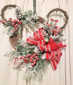 a christmas wreath with red and white decorations