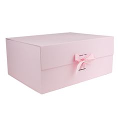 a pink box with a bow on the lid