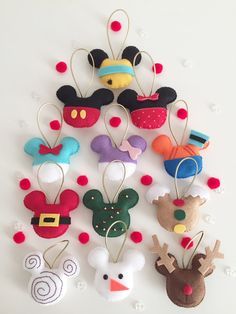 mickey mouse and friends christmas ornament hanging on the wall with red polka dots