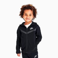 They're the reigning champion of the playground. Ensure they can rule in comfort and style with the easy-to-mix-and-match Kids' Toddler Nike Tech Fleece Full-Zip Hoodie and Joggers Set. Features: Soft, cozy Tech Fleece material offers lightweight warmth Futura branding for an athletic vibeÂ Jacket: Secure banded trim and front zip closure for stay-put wear, sporty raglan sleeves, stylish chevron detail, and an attached hood with funnel neck shields from elements Joggers: Classic tapered silhouet Tech Fleece Outfit, Fleece Outfit, Hoodie And Joggers, Kids Sportswear, Nike Tracksuit, Toddler Nikes, Joggers Set, Nike Tech Fleece, Nike Tech