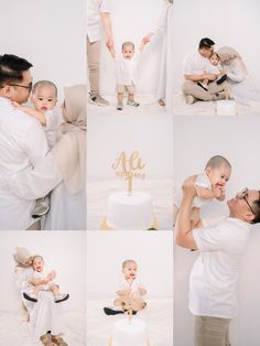 a man holding a baby in front of a cake