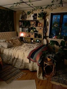 a bed room with a neatly made bed and lots of plants on the shelves next to it