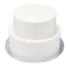 three tiered white cake sitting on top of a plate